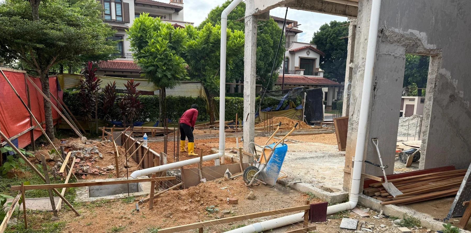 Ground-level work beside the Diamond Residence building
